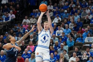 Creighton Bluejay Josh Dix (4) shoots over a defender during a college basketball game against Villanova on Feb 14, 2026, in Omaha, Nebraska. Photo by Brandon Tiedemann