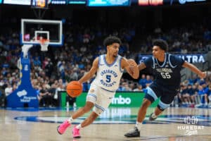 Creighton Bluejay Nik Graves (5) dribbles during a college basketball game against Villanova on Feb 14, 2026, in Omaha, Nebraska. Photo by Brandon Tiedemann
