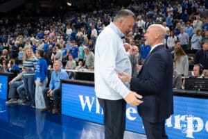 Creighton Bluejay head coach Greg McDermott and Villanova head coach Kevin Willard meet before a college basketball game on Feb 14, 2026, in Omaha, Nebraska. Photo by Brandon Tiedemann