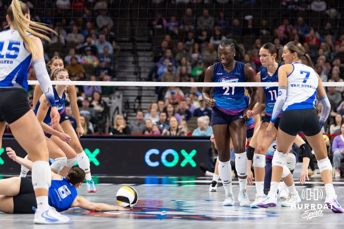 Omaha Supernovas Toyosi Onabanjo (21) watches Dallas Pulse Kylie Murr (6) get a pancake save after making a block during a professional volleyball match on Thursday, Feb. 12, 2026, in Omaha, Nebraska. Photo by John S. Peterson.