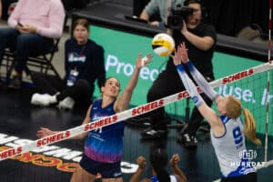 Omaha Supernova Sarah Parsons (11) tips the ball against Dallas Pulse Kaylee Cox (9) during a professional volleyball match on Thursday, Feb. 12, 2026, in Omaha, Nebraska. Photo by John S. Peterson.