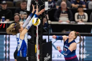 Omaha Supernovas Emily Londot (27) spikes the ball past Dallas Pulse Tristin Savage (22) during a professional volleyball match on Thursday, Feb. 12, 2026, in Omaha, Nebraska. Photo by John S. Peterson.