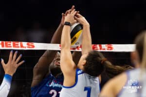 Omaha Supernovas Toyosi Onabanjo (21) and Dallas Pulse Natalia Valentin-Anderson (1) battle at the net in the first set during a professional volleyball match on Thursday, Feb. 12, 2026, in Omaha, Nebraska. Photo by John S. Peterson.