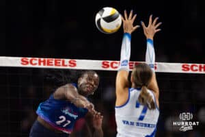 Omaha Supernovas Toyosi Onabanjo (21) spikes the ball against Dallas Pulse Layne Van Buskirk (7) in the first set during a professional volleyball match on Thursday, Feb. 12, 2026, in Omaha, Nebraska. Photo by John S. Peterson.