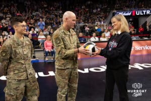 Omaha Supernovas president Diane Mendenhall presents a game ball to Lieutenant General Michael J. Lutton the Depty Commander Strategic Command during a professional volleyball match against the Dallas Pulse on Thursday, Feb. 12, 2026, in Omaha, Nebraska. Photo by John S. Peterson.