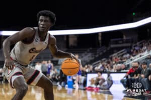 Omaha Maverick Ja'Sean Glover (5) looks to pass during a college basketball game against St. Thomas on Feb 12, 2026, in Omaha, Nebraska. Photo by Brandon Tiedemann