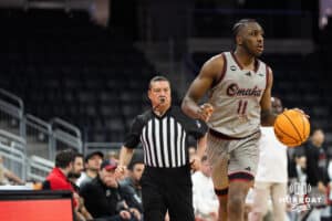 Omaha Maverick Paul Djobet (11) takes the ball up court during a college basketball game against St. Thomas on Feb 12, 2026, in Omaha, Nebraska. Photo by Brandon Tiedemann