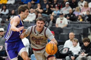 Omaha Maverick Tony Osburn (32) drives to the hoop during a college basketball game against St. Thomas on Feb 12, 2026, in Omaha, Nebraska. Photo by Brandon Tiedemann