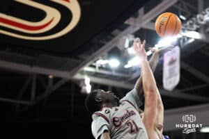 Omaha Maverick Valentino Simon (21) fights for a rebound during a college basketball game against St. Thomas on Feb 12, 2026, in Omaha, Nebraska. Photo by Brandon Tiedemann