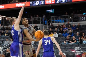 Omaha Maverick Grant Stubblefield (3) slips the ball past a defender during a college basketball game against St. Thomas on Feb 12, 2026, in Omaha, Nebraska. Photo by Brandon Tiedemann
