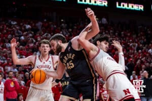 Nebraska Cornhusker forward Berke Buyuktuncel (9) gets tangled up with Purdue Boilermaker center Oscar Cluff (45) and a foul call in the second half during a college basketball game on Tuesday, Feb. 10, 2026, in Lincoln, Nebraska. Photo by John S. Peterson.