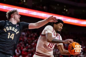 Nebraska Cornhusker guard Jamarques Lawrence (10) grabs the rebound against Purdue Boilermaker guard Jack Benter (14) in the second half during a college basketball game on Tuesday, Feb. 10, 2026, in Lincoln, Nebraska. Photo by John S. Peterson.