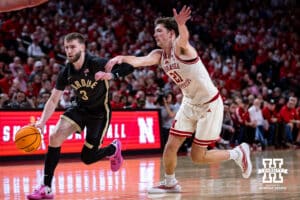Nebraska Cornhusker forward Pryce Sandfort (21) guards Purdue Boilermaker guard Braden Smith (3) in the second half during a college basketball game on Tuesday, Feb. 10, 2026, in Lincoln, Nebraska. Photo by John S. Peterson.