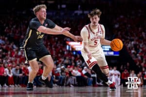 Nebraska Cornhusker forward Braden Frager (5) drives to the basket against Purdue Boilermaker guard Jack Benter (14) in the first half during a college basketball game on Tuesday, Feb. 10, 2026, in Lincoln, Nebraska. Photo by John S. Peterson.