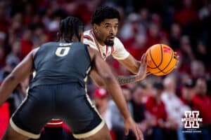 Nebraska Cornhusker guard Jamarques Lawrence (10) makes a pass against Purdue Boilermaker guard C.j.c.ox (0) in the first half during a college basketball game on Tuesday, Feb. 10, 2026, in Lincoln, Nebraska. Photo by John S. Peterson.