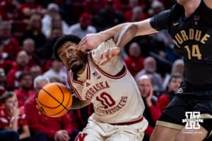 Nebraska Cornhusker guard Jamarques Lawrence (10) drives to the basket against Purdue Boilermaker guard Jack Benter (14) in the first half during a college basketball game on Tuesday, Feb. 10, 2026, in Lincoln, Nebraska. Photo by John S. Peterson.