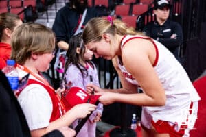 Nebraska Cornhusker forward Petra Bozan (4) signs an autograph for a fan after the game against the Maryland Terrapins during a women’s basketball game on Saturday, Feb. 7, 2026, in Lincoln, Nebraska. Photo by John S. Peterson.