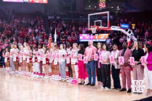 The Nebraska Cornhuskers and the Maryland Terrapins both held signs for the Pink Out game, honoring those they stand up to cancer, before the basketball game on Saturday, Feb. 7, 2026, in Lincoln, Nebraska. Photo by John S. Peterson.