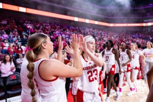 Nebraska Cornhusker Britt Prince (23) and Logan Nissley (2) give each other high fives before taking on the Maryland Terrapins during a women’s basketball game on Saturday, Feb. 7, 2026, in Lincoln, Nebraska. Photo by John S. Peterson.