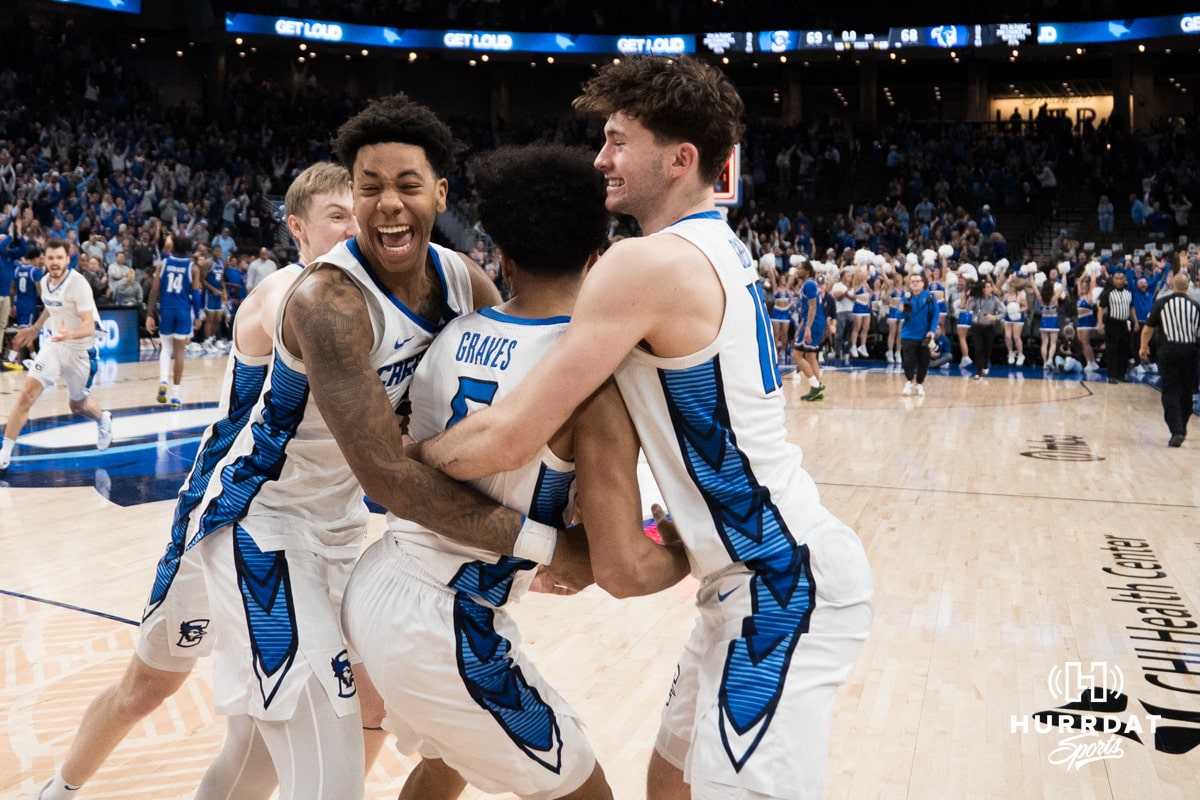 Creighton Bluejays swarm Nik Graves (5) after his game winner during a college basketball game against Seton Hall on Feb 7, 2026, in Omaha, Nebraska. Photo by Brandon Tiedemann