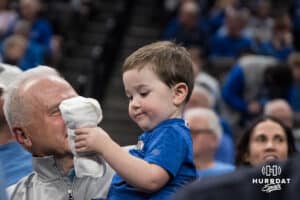 A young Creighton Bluejay fan stares at a t-shirt during a college basketball game against Seton Hall on Feb 7, 2026, in Omaha, Nebraska. Photo by Brandon Tiedemann