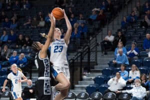 Creighton Bluejay Neleigh Gessert (23) shoots a contested layup during a college basketball game against Georgetown on Feb 4, 2026, in Omaha, Nebraska. Photo by Brandon Tiedemann