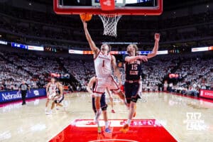 Nebraska Cornhusker guard Sam Hoiberg (1) makes a lay up against Illinois Fighting Illini forward Jake Davis (15) in the second half during a college basketball game on Sunday, Feb. 1, 2026, in Lincoln, Nebraska. Photo by John S. Peterson.