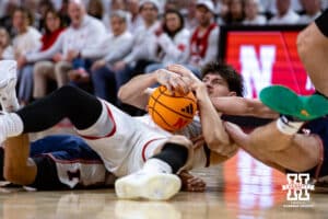 Nebraska Cornhusker forward Berke Büyüktuncel (9) fights for a loose ball against the Illinois Fighting Illini in tha during a college basketball game on Sunday, Feb. 1, 2026, in Lincoln, Nebraska. Photo by John S. Peterson.