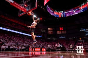 Connor Schutt makes a dunk in the Nebraska Football team dunk contest during a college basketball game against the Illinois Fighting Illini on Sunday, Feb. 1, 2026, in Lincoln, Nebraska. Photo by John S. Peterson.