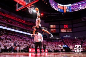 Quinn Clark makes a dunk in the Nebraska Football team dunk contest during a college basketball game against the Illinois Fighting Illini on Sunday, Feb. 1, 2026, in Lincoln, Nebraska. Photo by John S. Peterson.