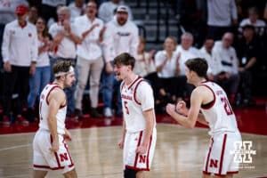 Nebraska Cornhusker forward Braden Frager (5) and forward Pryce Sandfort (21) celebrates guard Sam Hoiberg (1) basket against the Illinois Fighting Illini in the second half during a college basketball game on Sunday, Feb. 1, 2026, in Lincoln, Nebraska. Photo by John S. Peterson.