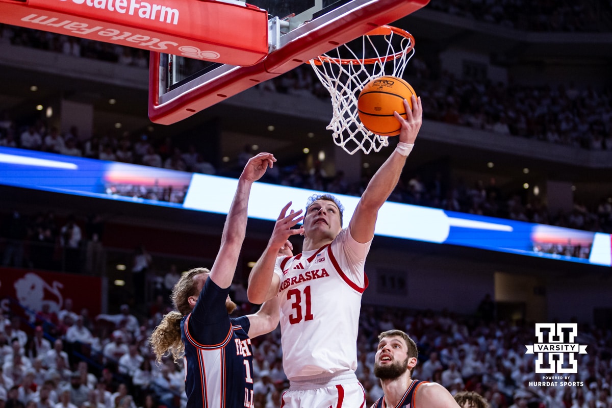 Nebraska Cornhusker guard Cale Jacobsen (31) makes a lay up against Illinois Fighting Illini forward Jake Davis (15) in the first half during a college basketball game on Sunday, Feb. 1, 2026, in Lincoln, Nebraska. Photo by John S. Peterson.