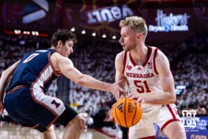 Nebraska Cornhusker forward Rienk Mast (51) drives the baseline against Illinois Fighting Illini forward David Mirkovic (0) in the first half during a college basketball game on Sunday, Feb. 1, 2026, in Lincoln, Nebraska. Photo by John S. Peterson.