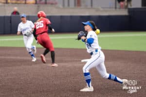 Creighton Bluejay Tara Vandewater (24) throws to first base during a college softball game against Nebraska on March 31, 2026, in Omaha, Nebraska. Photo by Brandon Tiedemann