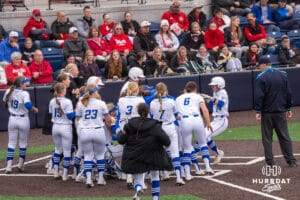 Creighton Bluejays celebrate at home plate Tara Vandewater (24) home-run during a college softball game against Nebraska on March 31, 2026, in Omaha, Nebraska. Photo by Brandon Tiedemann