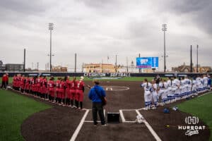 Nebraska Cornhuskers and Creighton Bluejays stand for the anthem during a college softball game against on March 31, 2026, in Omaha, Nebraska. Photo by Brandon Tiedemann