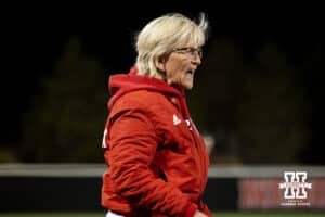 Nebraska head coach Rhonda Revelle calls for the next pitch during a college softball game against UCLA, Mar. 27, 2026, Lincoln, Nebraska. Photo by Braden Cochran.