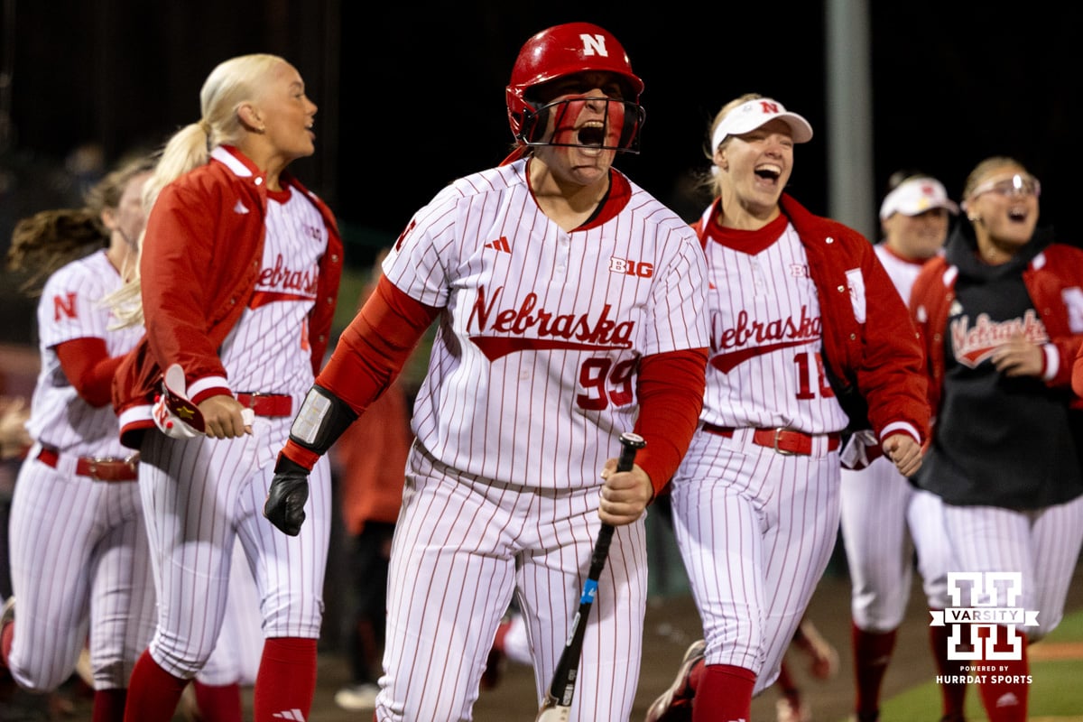 Nebraska pitcher Alexis Jensen (99) celebrates a home run as batter Hannah Camenzind (9) rounds the bases during a college softball game against UCLA, Mar. 27, 2026, Lincoln, Nebraska. Photo by Braden Cochran.