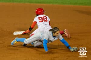 Nebraska Cornhusker Jordy Frahm (98) slides for second base past a UCLA defender during a college softball game against UCLA, Mar. 27, 2026, Lincoln, Nebraska. Photo by Braden Cochran.