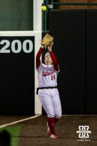 Nebraska Cornhusker Kacie Hoffman (14) catches a pop fly just beyond the foul line during a college softball game against UCLA Mar. 27, 2026, Lincoln, Nebraska. Photo by Braden Cochran.