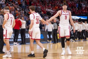 Nebraska Cornhusker forward Berke Büyüktuncel (9) gives guard Cale Jacobsen (31) five after the loss to the Iowa Hawkeyes during the Sweet Sixteen of the NCAA Men’s Basketball Championship on Thursday, March 26, 2026, in Houston. Photo by John S. Peterson.