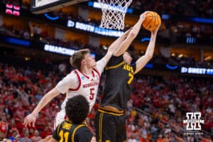 Nebraska Cornhusker forward Braden Frager (5) reaches for the rebound against Iowa Hawkeye forward Alvaro Folgueiras (7) in the second half during the Sweet Sixteen of the NCAA Men’s Basketball Championship on Thursday, March 26, 2026, in Houston. Photo by John S. Peterson.