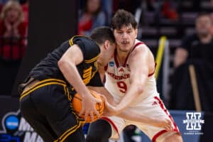 Nebraska Cornhusker forward Berke Büyüktuncel (9) reaches for the ball against Iowa Hawkeye forward Alvaro Folgueiras (7) in the second half during the Sweet Sixteen of the NCAA Men’s Basketball Championship on Thursday, March 26, 2026, in Houston. Photo by John S. Peterson.