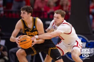 Nebraska Cornhusker guard Cale Jacobsen (31) reaches for the ball against Iowa Hawkeye guard Tate Sage (24) in the second half during the Sweet Sixteen of the NCAA Men’s Basketball Championship on Thursday, March 26, 2026, in Houston. Photo by John S. Peterson.