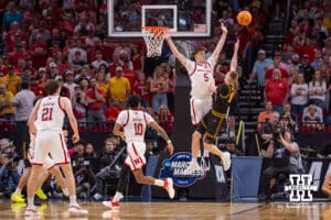 Iowa Hawkeye guard Bennett Stirtz (14) makes a basket over Nebraska Cornhusker forward Braden Frager (5) in the second half during the Sweet Sixteen of the NCAA Men’s Basketball Championship on Thursday, March 26, 2026, in Houston. Photo by John S. Peterson.