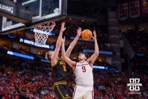 Iowa Hawkeye forward Cooper Koch (8) breaks up a layup by Nebraska Cornhusker forward Berke Büyüktuncel (9) in the second half during the Sweet Sixteen of the NCAA Men’s Basketball Championship on Thursday, March 26, 2026, in Houston. Photo by John S. Peterson.