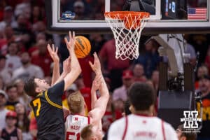 Nebraska Cornhusker forward Rienk Mast (51) battles for a rebound against Iowa Hawkeye forward Alvaro Folgueiras (7) in the first half during the Sweet Sixteen of the NCAA Men’s Basketball Championship on Thursday, March 26, 2026, in Houston. Photo by John S. Peterson.