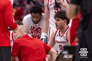 Nebraska Cornhusker forward Berke Büyüktuncel (9) listening in the huddle at a break in the action against the Iowa Hawkeyes during the Sweet Sixteen of the NCAA Men’s Basketball Championship on Thursday, March 26, 2026, in Houston. Photo by John S. Peterson.