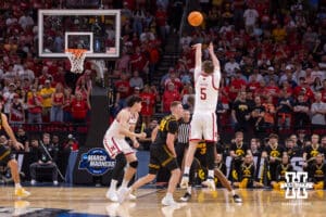 Nebraska Cornhusker forward Braden Frager (5) makes a three point basket against the Iowa Hawkeyes in the first half during the Sweet Sixteen of the NCAA Men’s Basketball Championship on Thursday, March 26, 2026, in Houston. Photo by John S. Peterson.