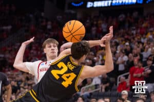 Nebraska Cornhusker forward Braden Frager (5) breaks up pass against Iowa Hawkeye guard Tate Sage (24) in the first half during the Sweet Sixteen of the NCAA Men’s Basketball Championship on Thursday, March 26, 2026, in Houston. Photo by John S. Peterson.